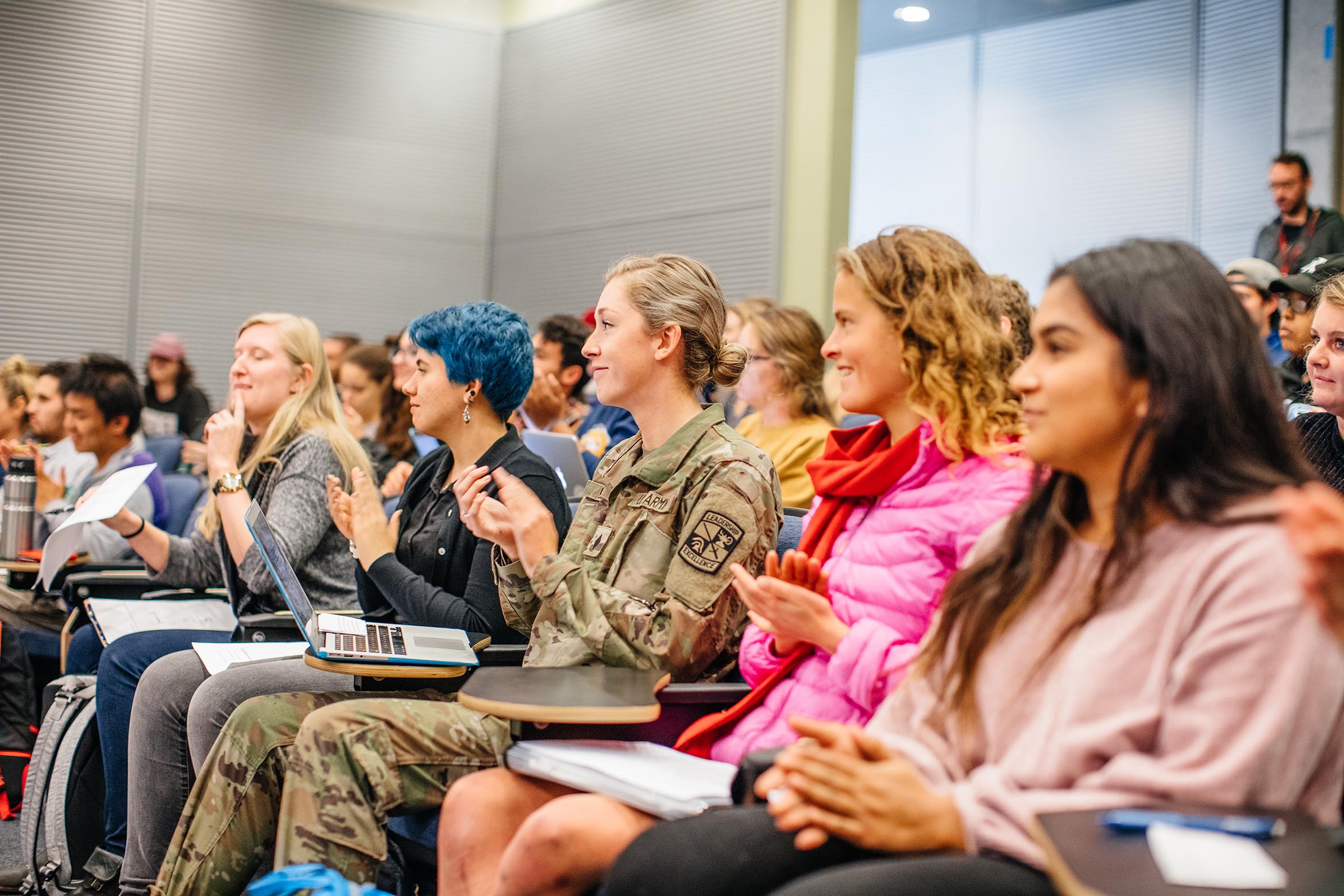 Students sit in a lecture hall on campus.