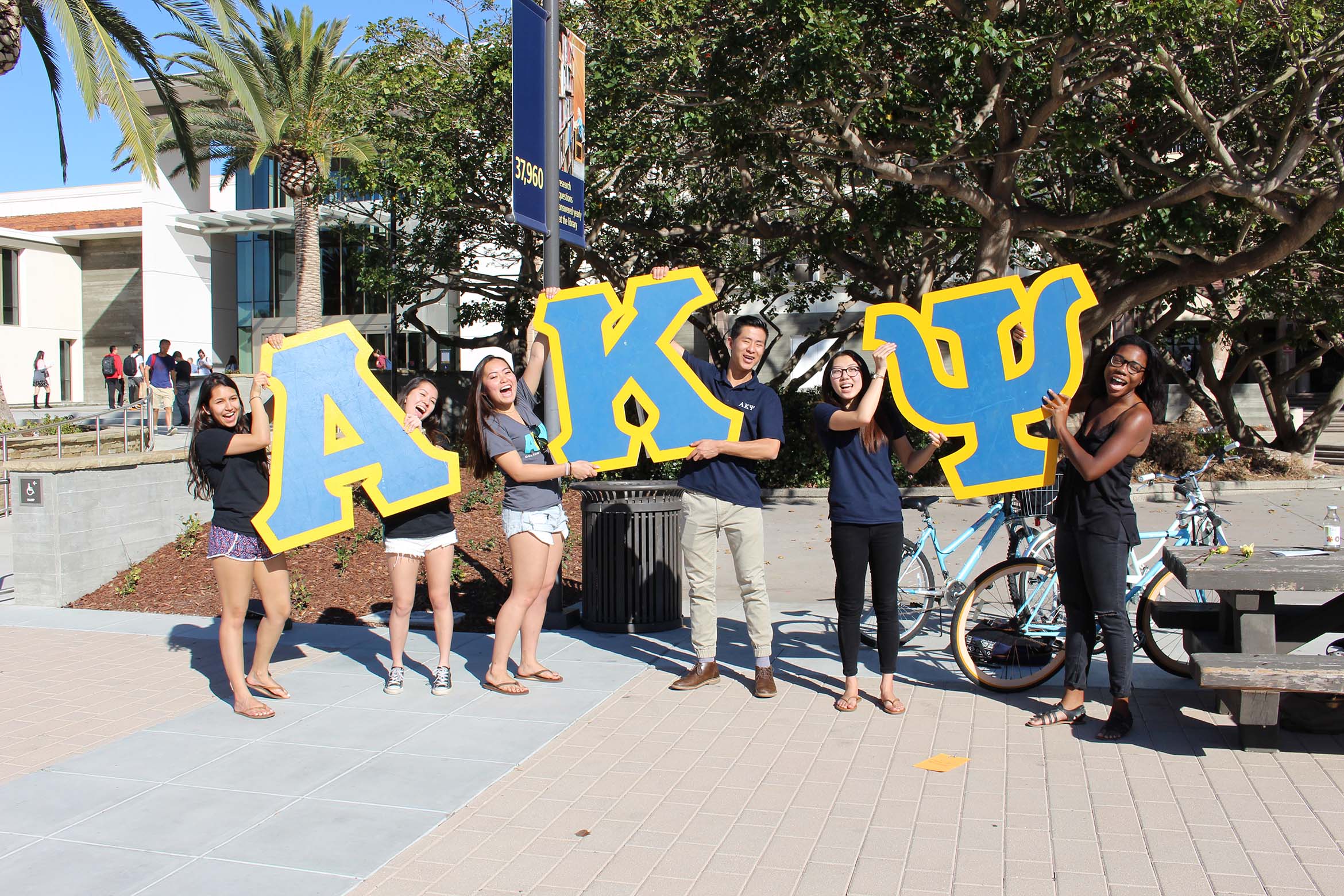 This is AKA students holding their Greek letters.