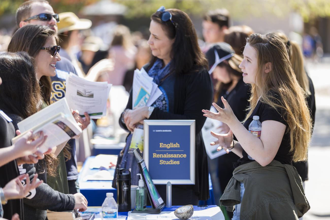 A student talks to an academic department at Open House.